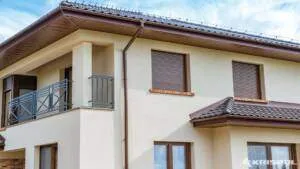 house with windows and yellow facade